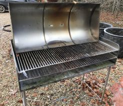 WITHDRAWN A modern bespoke stainless steel natural fire barbecue with cover,