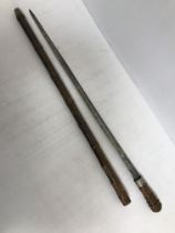 A 19th Century bamboo cased swordstick, the blade bearing silhouette mark,