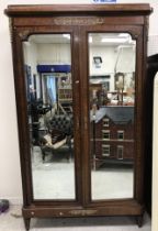 A 19th Century French mahogany double mirror door wardrobe or armoire in the Louis XVI taste,