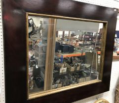 A 19th Century rosewood framed rectangular wall mirror with gilt slip, 92.5 cm x 77.