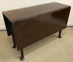 A 19th Century mahogany rectangular drop leaf dining table on turned legs to pad feet and a 19th