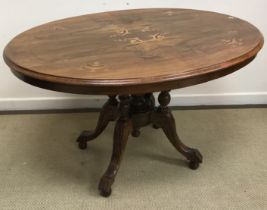 A Victorian walnut and marquetry inlaid oval loo table, on cluster column quadruped base,