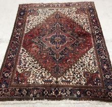 A Persian Heriz carpet,