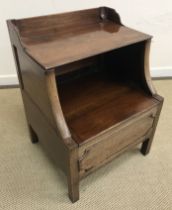 A 19th Century mahogany night table with three quarter gallery rising top over a lidded compartment