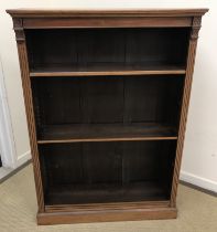A mahogany open bookcase in the Victorian manner,