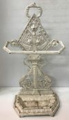 A Victorian Aesthetic period white painted cast iron stick stand with lozenge and floral spray