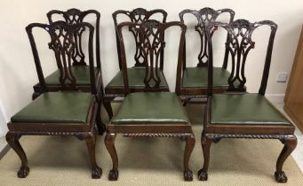 A set of eight early 20th Century mahogany Chippendale style dining chairs on cabriole legs to claw
