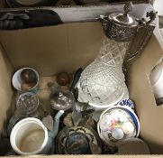 Two boxes of assorted decorative items to include a claret jug with plated mounts,