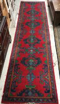 A collection of rugs comprising a Turkish style runner,