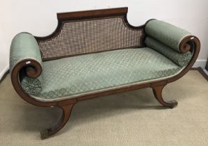An Edwardian mahogany and inlaid salon settee in the Regency style of small proportions,