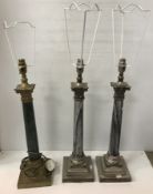 A pair of white metal and marble Corinthian column table lamps, 56.