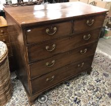 A Victorian mahogany square front chest of two short over three long graduated drawers raised on