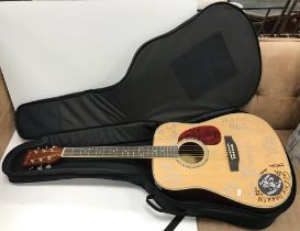 A Harley Benton Custom Line HBD-120NA acoustic guitar with various signatures of members of Edison