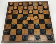 A 19th Century rosewood bound draughts / chess board box opening to reveal a plain interior