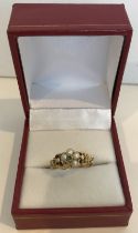 An un-marked yellow metal emerald and seed pearl dress ring (one pearl missing), 2.