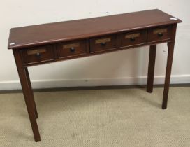 A mahogany side table in the pharmacists manner,