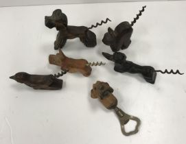 A collection of carved wooden handled corkscrews with figural / animal, etc.