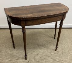 A Regency rosewood card table of bow fronted outline,