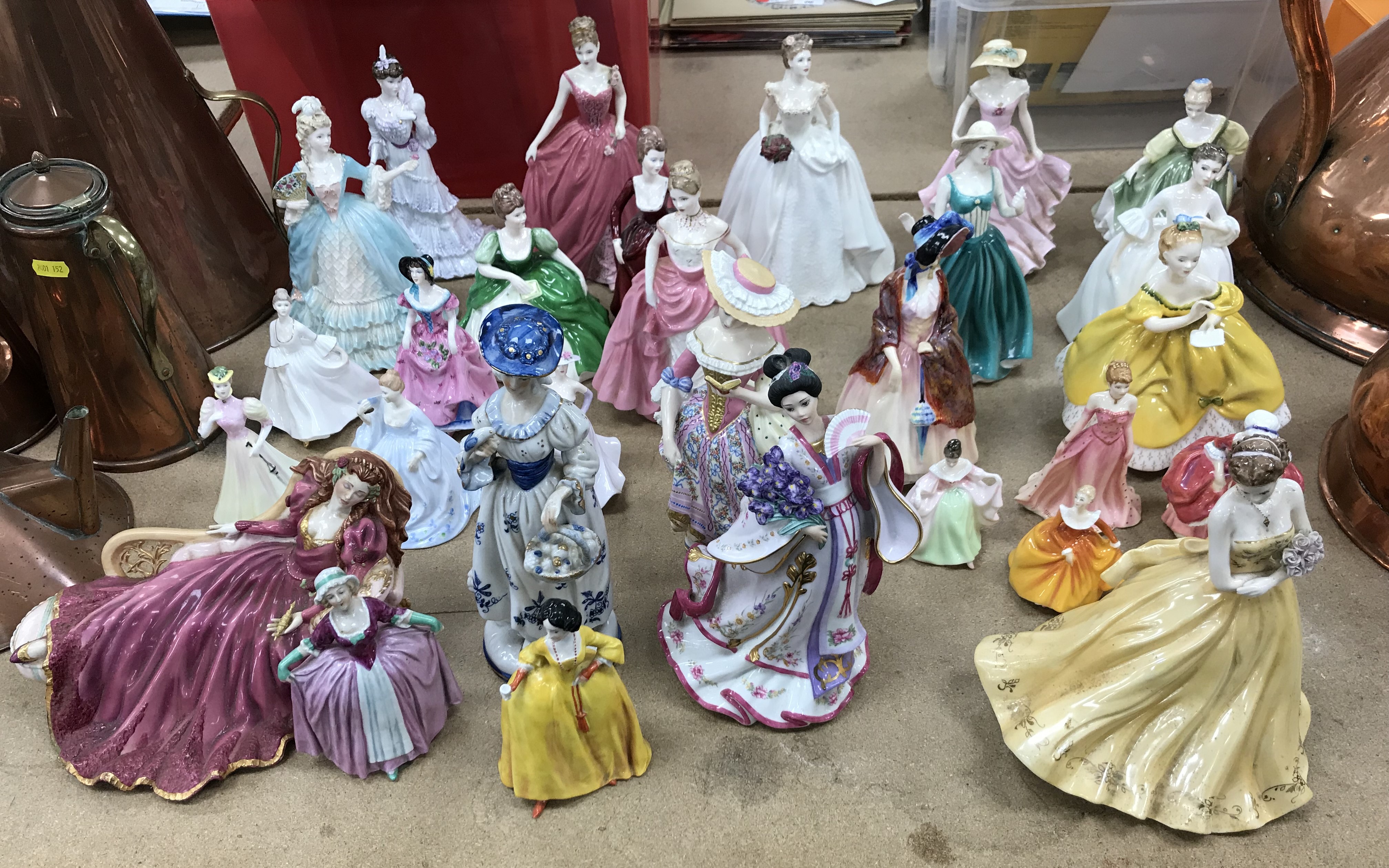 A collection of twenty-nine various figurines to include ten Royal Doulton examples including