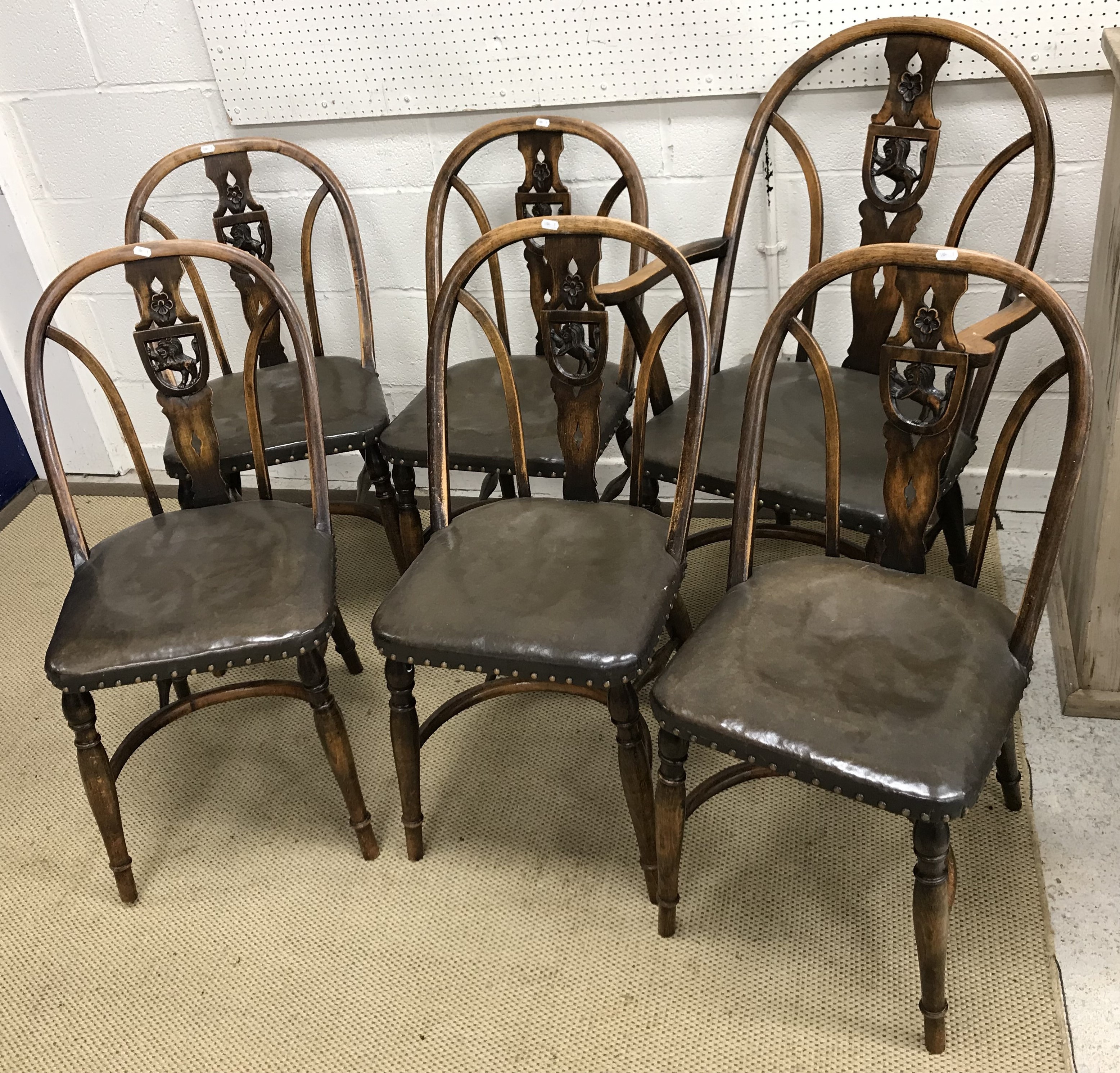 A set of six circa 1946 stained beech framed Windsor type dining chairs,