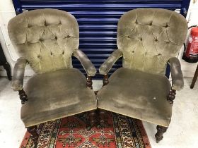 A pair of Victorian mahogany framed buttoned upholstered open arm chairs,