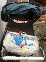 A Silver Cross coach built doll's pram in grey and burgundy with shopping tray, bag,