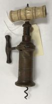 A 19th Century brass cylinder Thomason type double action corkscrew with turned bone handle (brush