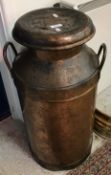 A coppered iron milk churn, indistinctly named and No'd.