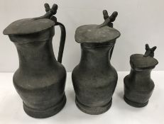 A graduated set of three 18th Century pewter tappit hens of baluster form,