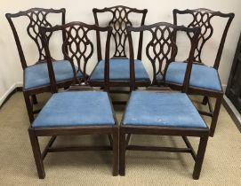 A set of five 19th Century mahogany Provincial Chippendale style dining chairs with ornate back