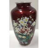 A 20th Century Japanese Ginbari cloisonné vase decorated with floral spray on a red ground raised