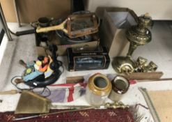A collection of items to include a brass mounted spark guard a large brass oil lamp with globe and