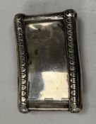 A late George III silver snuff box of crescent form with lotus leaf decoration (maker's marks not