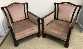 A pair of Edwardian mahogany show frame armchairs with upholstered back panel, arm panels and seat,