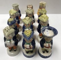 A collection of eight 19th Century Staffordshire pottery Toby peppers, a similar salt,