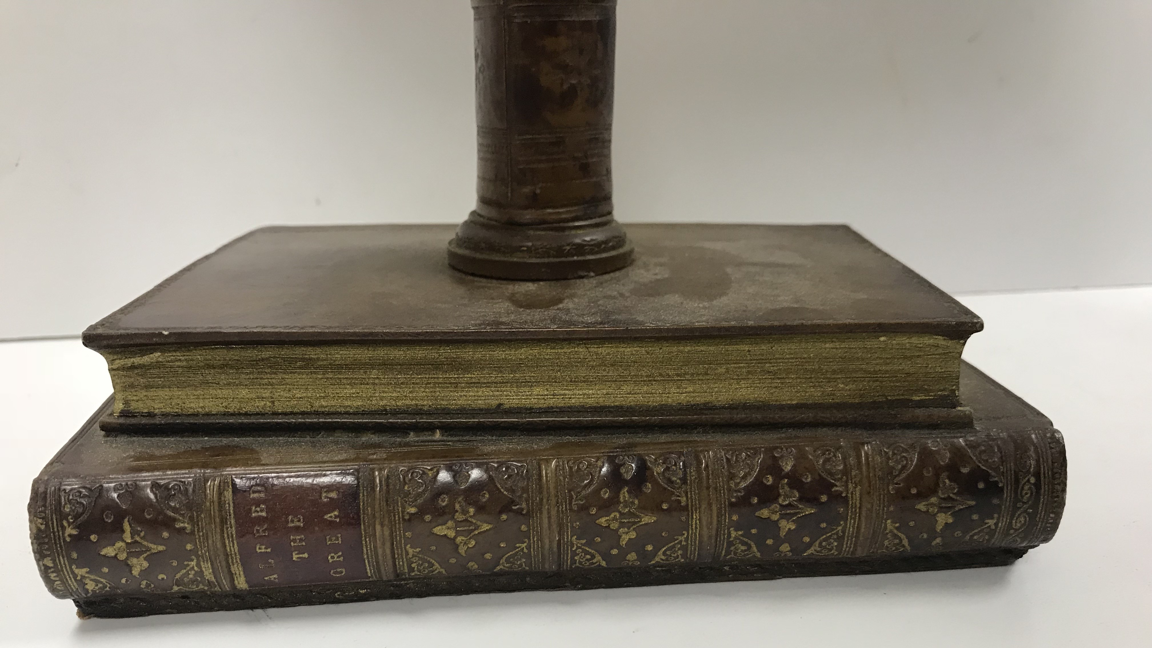 A decorative table lamp as book spines "Original Bookworks - 2" on a base of two books "Goldsmiths - Image 3 of 5