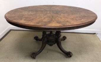 A Victorian burr walnut oval loo table on a quadruple cluster column base,