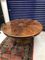 A Victorian figured mahogany breakfast table,