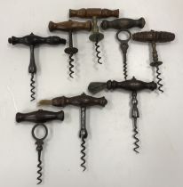 A collection of nine various wooden handled T bar corkscrews,