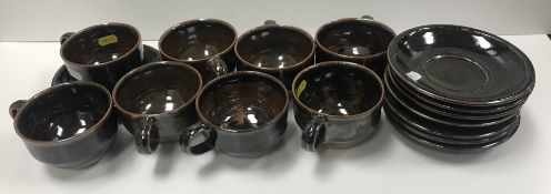 A set of eight Ray Finch Winchcombe Pottery teacups and saucers,