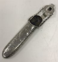 A Victorian silver and foliate engraved lorgnette or spectacle case on chatelain type clip (by