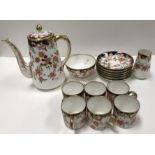 A Royal Crown Derby Japan pattern coffee service with all over flower head decoration (pattern No.