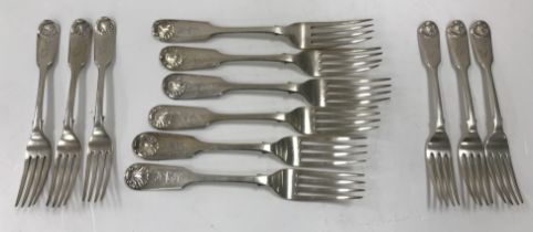 A set of six Victorian silver fiddle and shell pattern table forks (by John James Whiting,