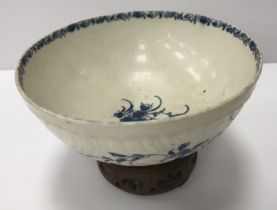 An 18th Century Worcester blue and white and relief decorated floral spray painted bowl,