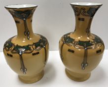 A pair of Wood & Sons Burslem "Elers ware" vases with stylised floral and foliate decoration in the