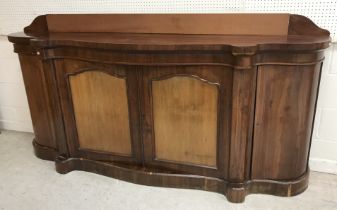 A Victorian rosewood serpentine fronted sideboard with shallow raised back and two central panelled