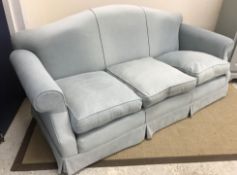 A modern turquoise upholstered three seat scroll arm sofa,