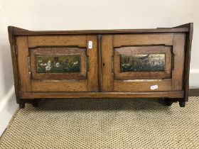 A circa 1900 oak hanging wall cupboard in the Arts & Crafts manner,