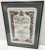 A framed and glazed silk panel inscribed "Corporation of London Luncheon to mark the 40th