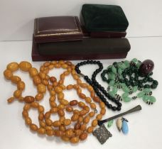 An amber bead necklace 102 g together with a graduated amber bead bracelet 48 g and three further